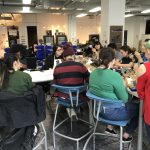 Students packed around worktables during a workshop at DePaul's Idea Realization Lab makerspace