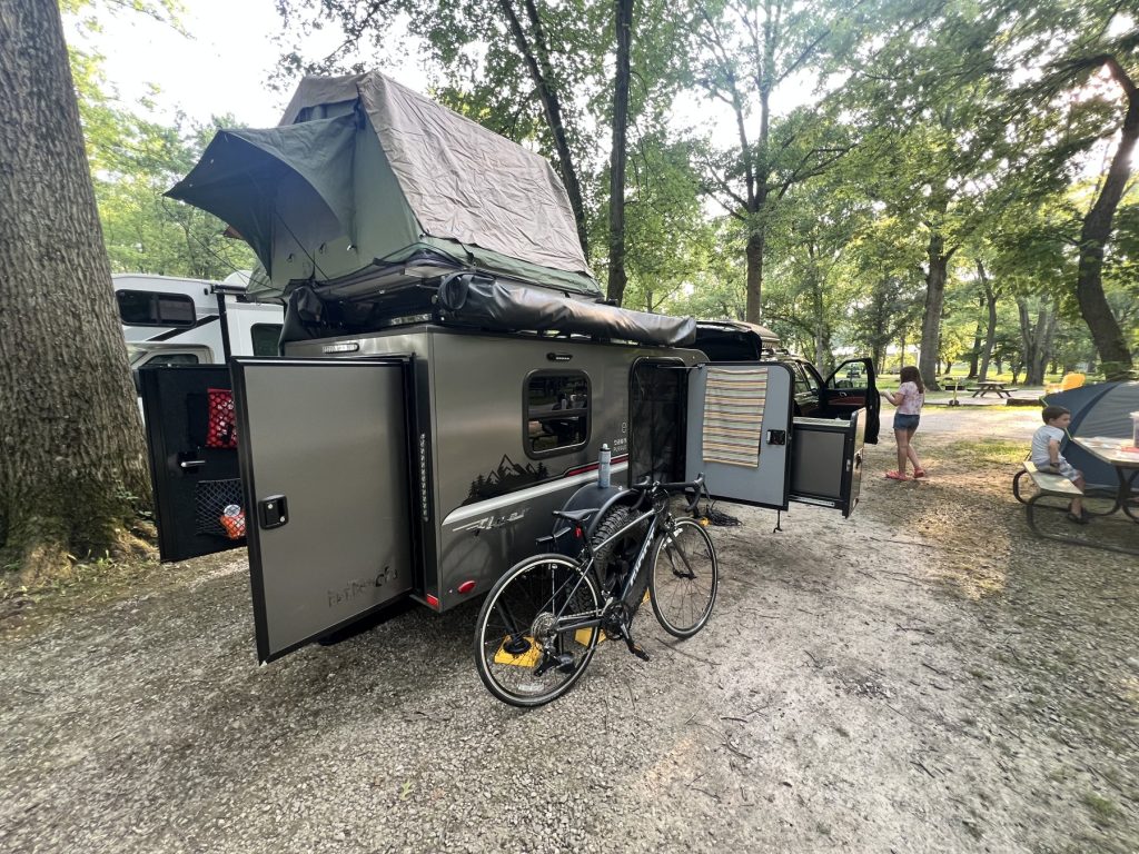 Camp at Buckeye Lake: tent out, doors open, bike ready for Iowa