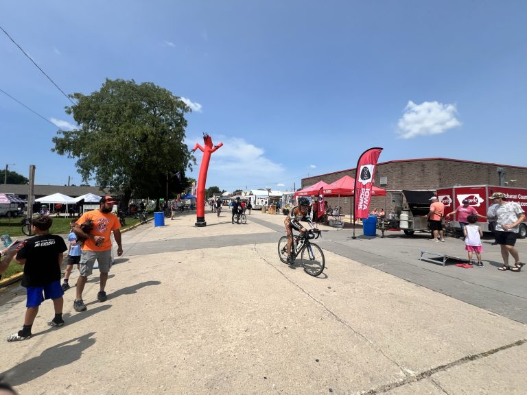 Jesup, the last pass-through town, holding it down with the Iowa Pork tent and a sky-dancer.