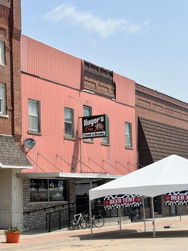 Kuger's Den in Jesup, fully deployed for RAGBRAI: beer tents out front, bikes racked where the parking used to be.