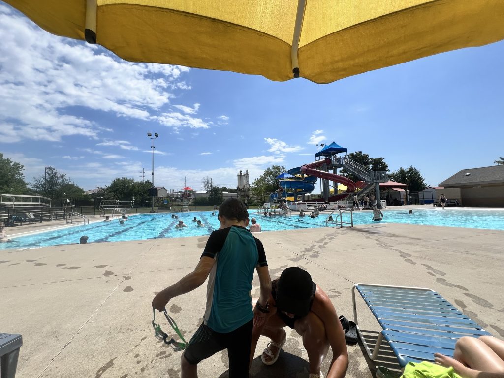 Post-swim regroup under the umbrella.
