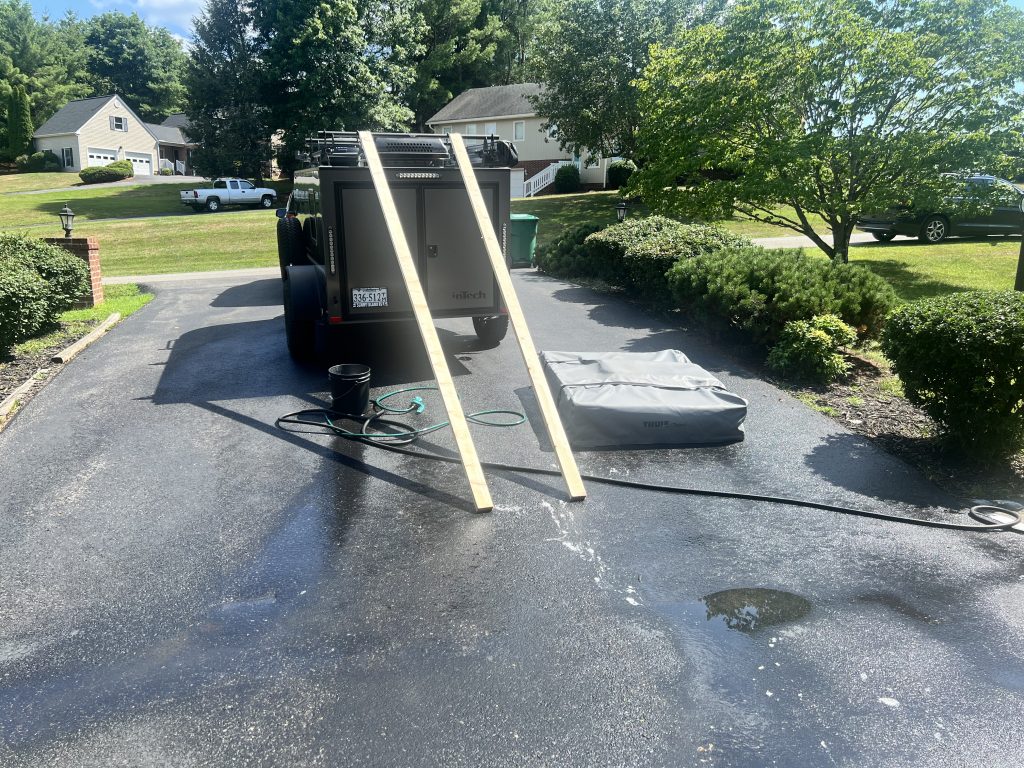 Wash day: the 2x4 loading rig and the Thule tent waiting on the driveway